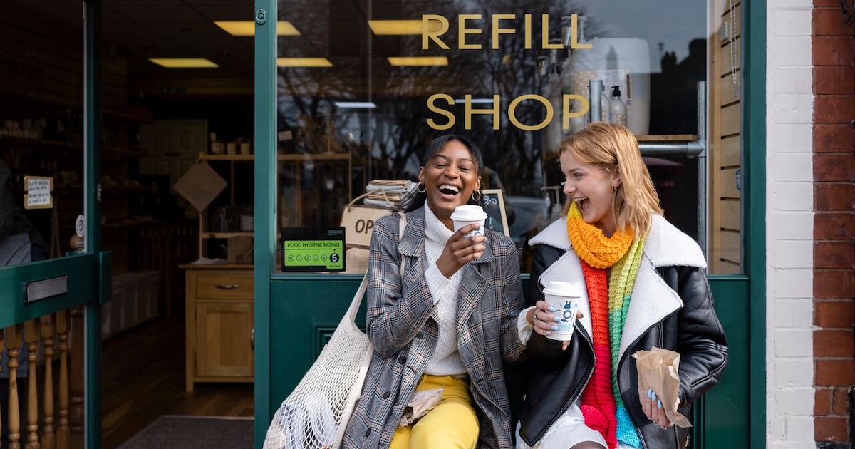 Two friends having coffee at a retail coffee shop